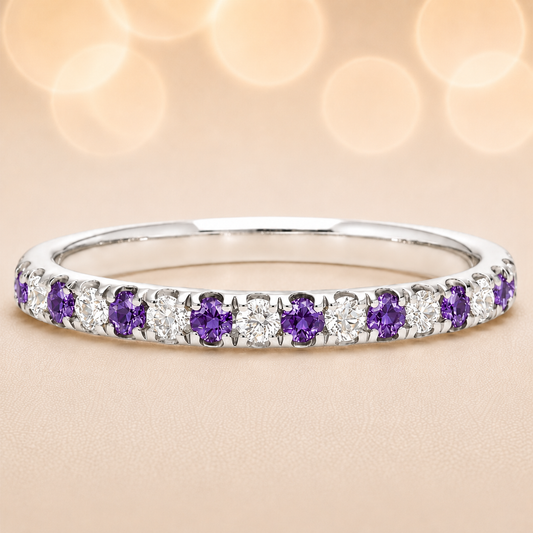 Purple sapphire wedding band with 1.80 mm round-cut stones, crafted in white gold-plated 925 silver and accented with moissanite. Available now at BSI Jewelry.