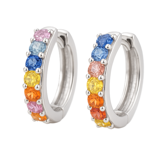 Vibrant rainbow sapphire huggie earrings with 3mm round brilliant stones, crafted in white gold-plated 925 silver with palladium-added alloy. Now at BSI Jewelry