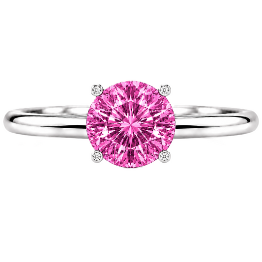 Pink sapphire engagement ring featuring a 6 mm round gemstone in white gold-plated 925 silver. Romantic, hypoallergenic, and elegant for everyday wear. Available now at BSI Jewelry.