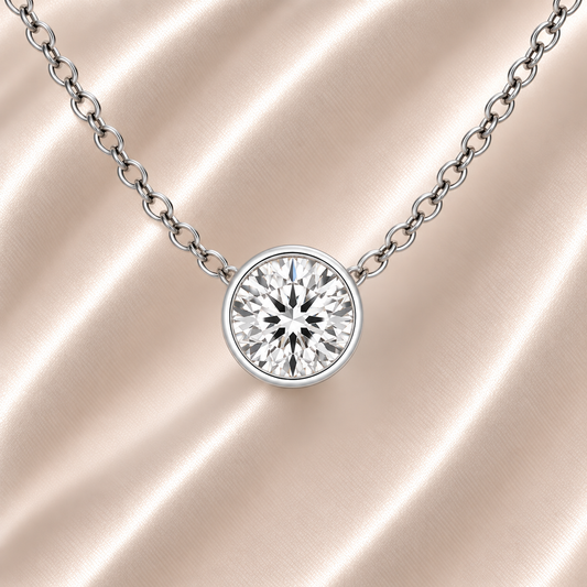 Round moissanite bezel necklace, 6 mm round, crafted in white gold-plated 925 silver. Minimal, elegant, and hypoallergenic. Available now at BSI Jewelry.