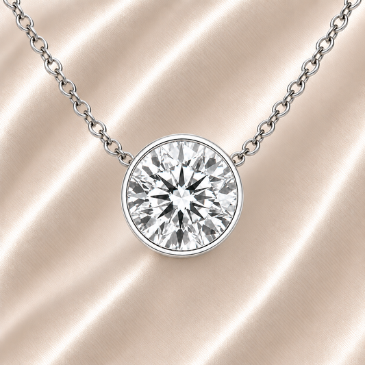 Round moissanite bezel necklace, 8 mm round, crafted in white gold-plated 925 silver. Hypoallergenic and elegant for daily wear. Available now at BSI Jewelry.