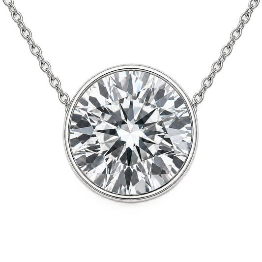 Round moissanite bezel necklace, 9 mm round, crafted in white gold-plated 925 silver. Hypoallergenic and elegant for daily wear. Available now at BSI Jewelry.