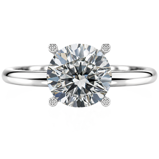 Timeless round moissanite engagement ring with a 6 mm brilliant-cut center stone, crafted in white gold plated 925 silver. Available now at BSI Jewelry.