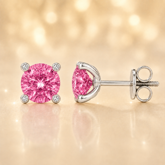 Round pink sapphire stud earrings with 5 mm stones and moissanite prongs in white gold plated 925 silver. Available now at BSI Jewelry.