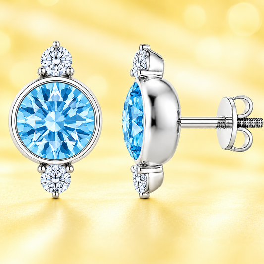 Sky blue topaz stud earrings, 7 mm round with moissanite accents in white gold-plated 925 silver. Elegant and hypoallergenic. Available now at BSI Jewelry.