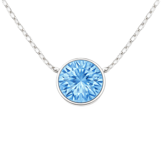 Sky blue topaz necklace with a 6 mm round in white gold-plated 925 silver. Elegant, hypoallergenic, and refined for daily wear. Available now at BSI Jewelry.