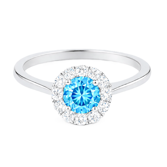 Sky blue topaz ring with a 4.50 mm round-cut in white gold-plated 925 silver, accented with moissanite for fresh blue brilliance. Available now at BSI Jewelry.