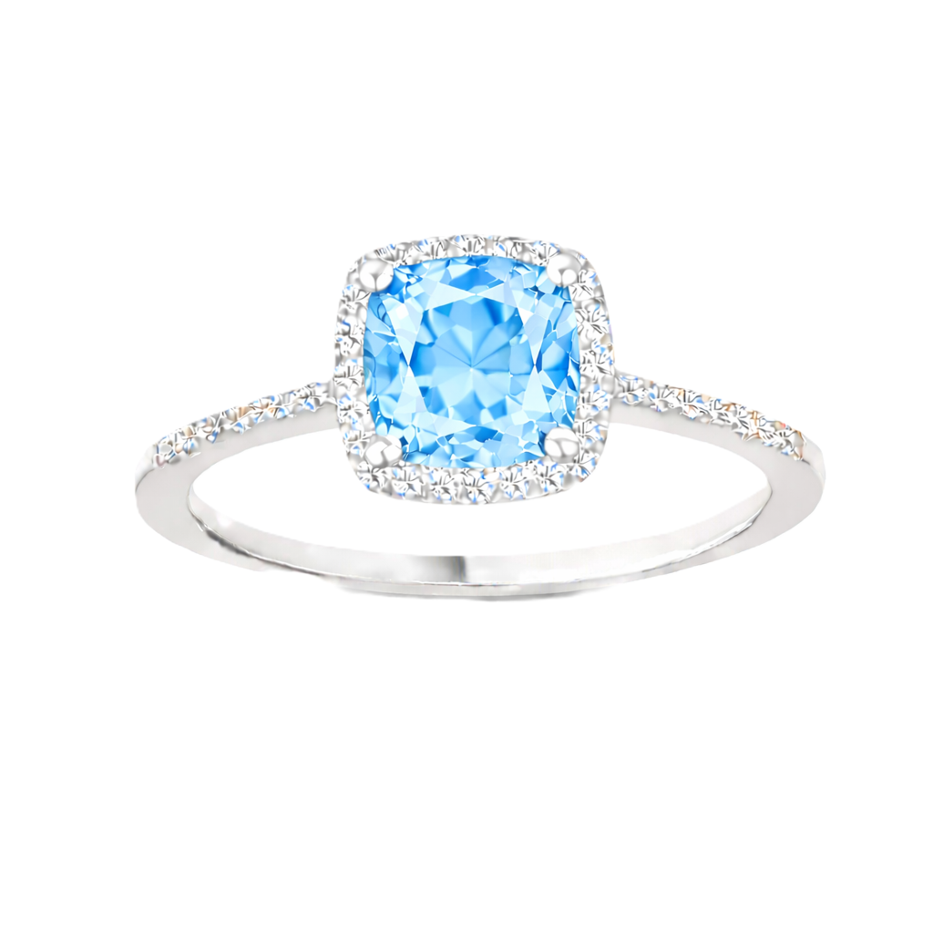 Sky blue topaz ring with a 6 mm cushion-cut center in white gold-plated 925 silver, accented with moissanite. Available now at BSI Jewelry.