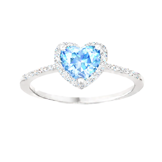 Sky blue topaz ring with a 6 mm heart cut, crafted in white gold-plated 925 silver and accented with moissanite. Available now at BSI Jewelry.