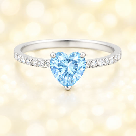 Sky blue topaz ring with a 6 mm heart in white gold-plated 925 silver, with moissanite. Romantic and elegant for daily wear. Available now at BSI Jewelry.