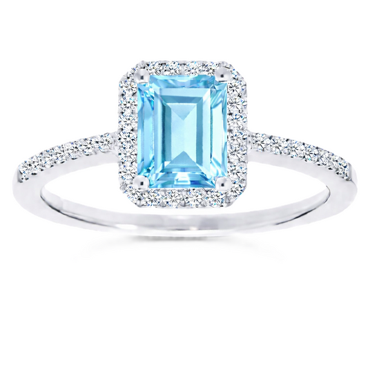Sky blue topaz ring with a 7×5 mm emerald cut, with moissanite in white gold-plated 925 silver. Elegant and timeless for daily wear. Available now at BSI Jewelry.