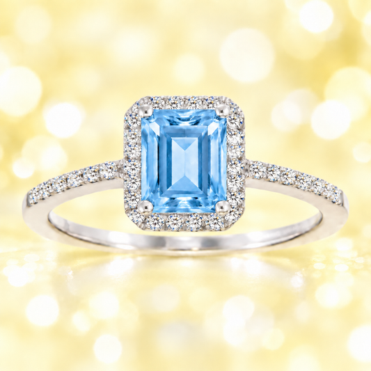 Sky blue topaz ring with a 7×5 mm emerald cut, with moissanite in white gold-plated 925 silver. Elegant and timeless for daily wear. Available now at BSI Jewelry.