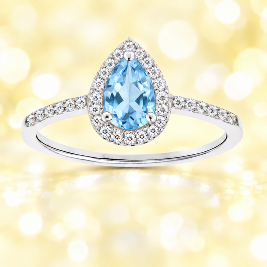 Sky blue topaz ring with a 7×5 mm pear cut, with moissanite in white gold-plated 925 silver. Elegant and timeless for daily wear. Available now at BSI Jewelry.