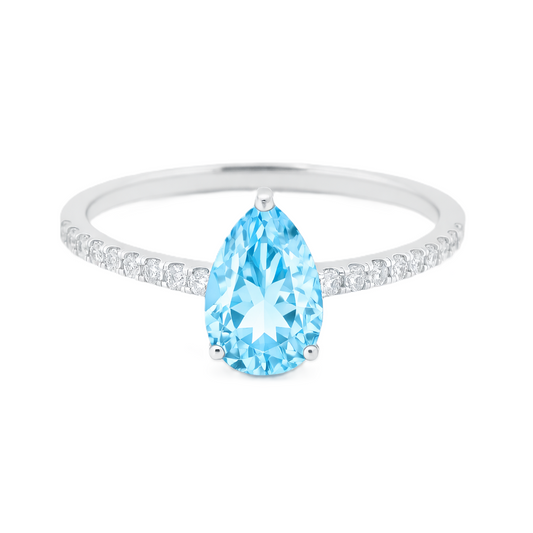 Sky blue topaz ring with a 7×5 mm pear-cut stone and moissanite accents in white gold plated 925 silver. Elegant for daily wear. Available now at BSI Jewelry.