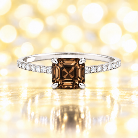 Smoky quartz ring with a 6 mm Asscher-cut stone in white gold-plated 925 silver, accented with moissanite and elegant warm brilliance. Available now at BSI Jewelry.