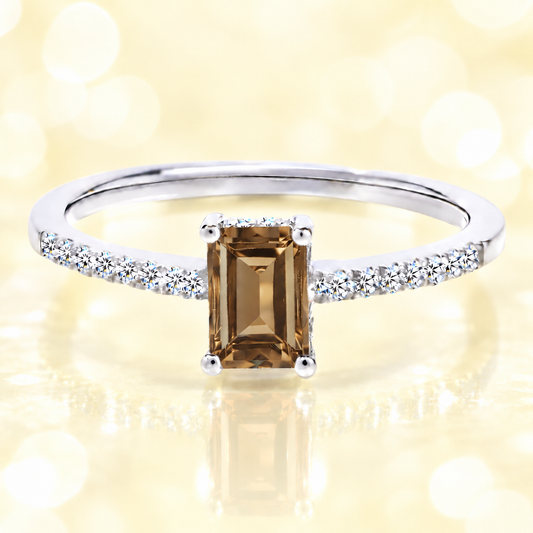 Smoky quartz ring with a 7×5 mm emerald cut in white gold-plated 925 silver, with moissanite. Elegant and refined for daily wear. Available now at BSI Jewelry.
