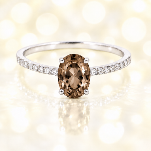 Smoky quartz ring with a 7×5 mm oval-cut stone and moissanite accents in white gold plated 925 silver. Elegant for daily wear. Available now at BSI Jewelry.
