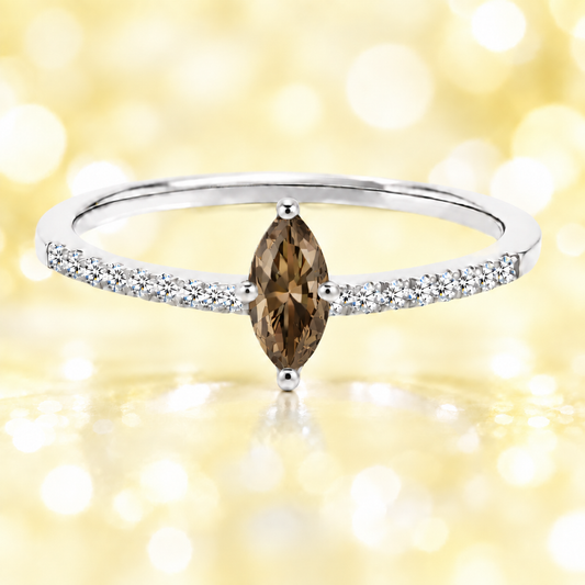 Smoky quartz ring with an 8×4 mm marquise-cut stone, accented by moissanite in white gold-plated 925 silver. Warm and elegant. Available now at BSI Jewelry.