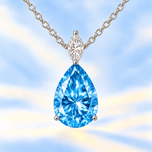 Swiss blue topaz pendant with a 12×8 mm pear-cut gemstone in white gold-plated 925 silver, with moissanite. Elegant for daily wear. Available now at BSI Jewelry.