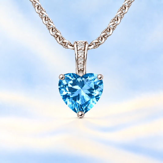 Swiss blue topaz pendant with a 6 mm heart gemstone in white gold-plated 925 silver. Cool, radiant, and elegant for daily wear. Available now at BSI Jewelry.