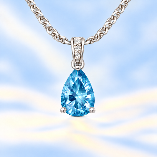 Swiss blue topaz pendant with an 8×5 mm pear cut, crafted in white gold-plated 925 silver. Vivid and elegant for daily wear. Available now at BSI Jewelry.