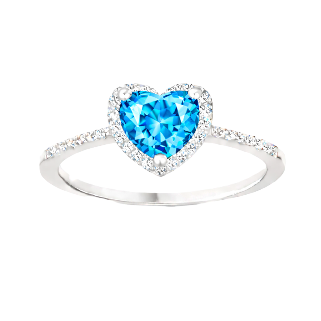 Swiss blue topaz ring with a 6 mm heart cut, crafted in white gold-plated 925 silver and accented with moissanite. Available now at BSI Jewelry.