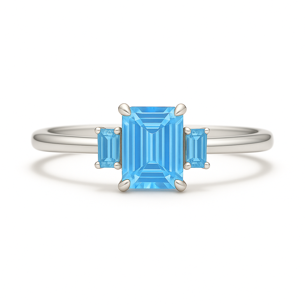 Striking Swiss blue topaz ring with 6×4 mm and 4×2 mm emerald-cut stones in white gold-plated 925 silver with palladium alloy. Radiant joy. Now at BSI Jewelry.