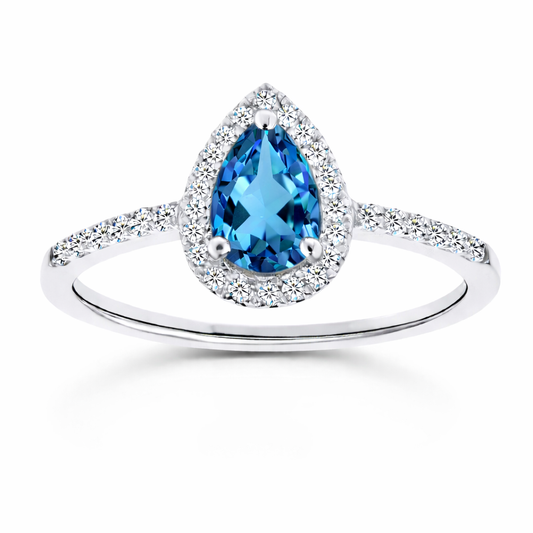 Swiss blue topaz ring with a 7×5 mm pear cut, with moissanite in white gold-plated 925 silver. Elegant and timeless for daily wear. Available now at BSI Jewelry.