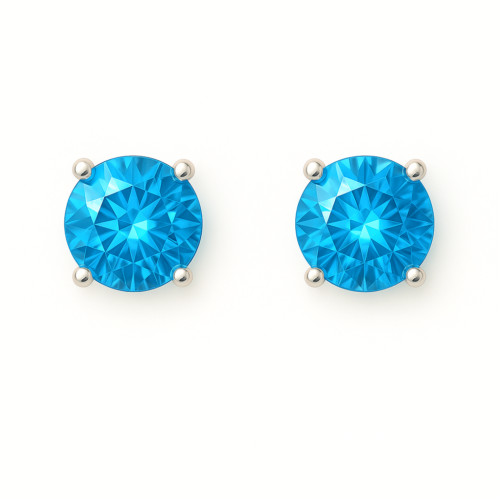 Swiss blue topaz stud earrings with 4 mm round cut, crafted in white gold-plated 925 silver and palladium alloy. Elegant sparkle. Available now at BSI Jewelry.
