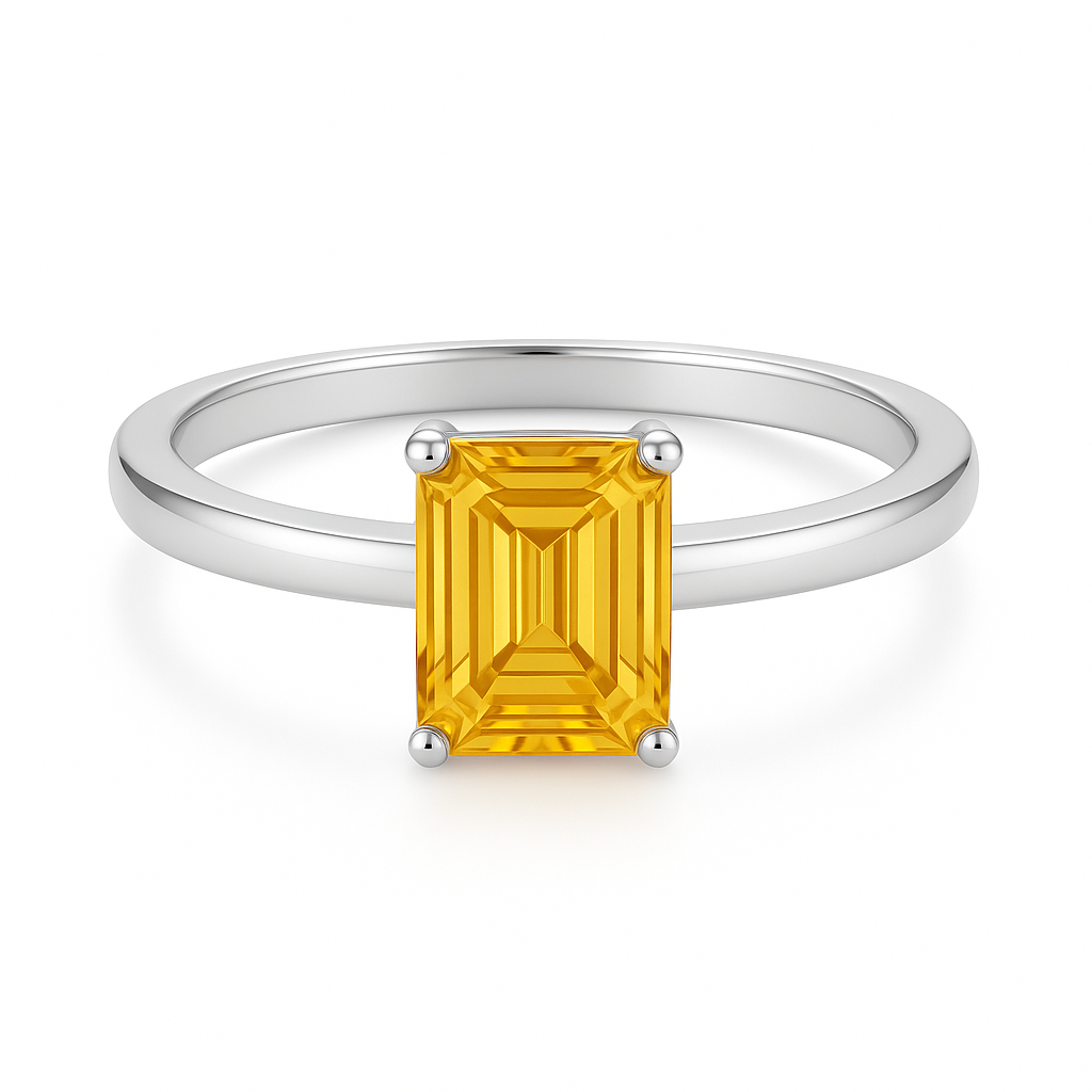 7×5 mm emerald-cut yellow sapphire solitaire ring set in white-gold-plated 925 silver. Radiant simplicity and timeless elegance. Available now at BSI Jewelry.