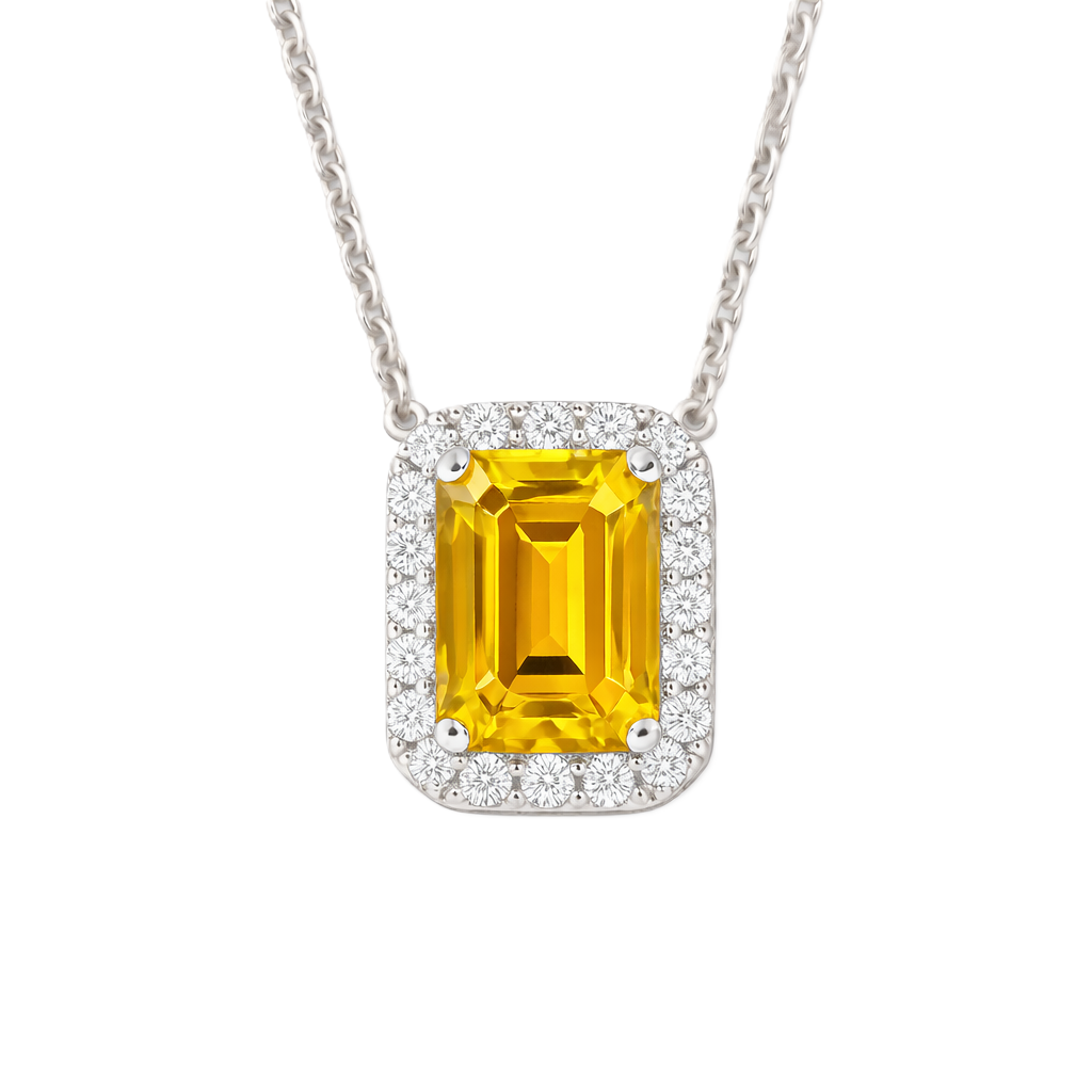 Yellow sapphire emerald cut necklace with 7×5 mm center stone in white gold-plated 925 silver. Radiant and elegant for everyday wear. Available now at BSI Jewelry.