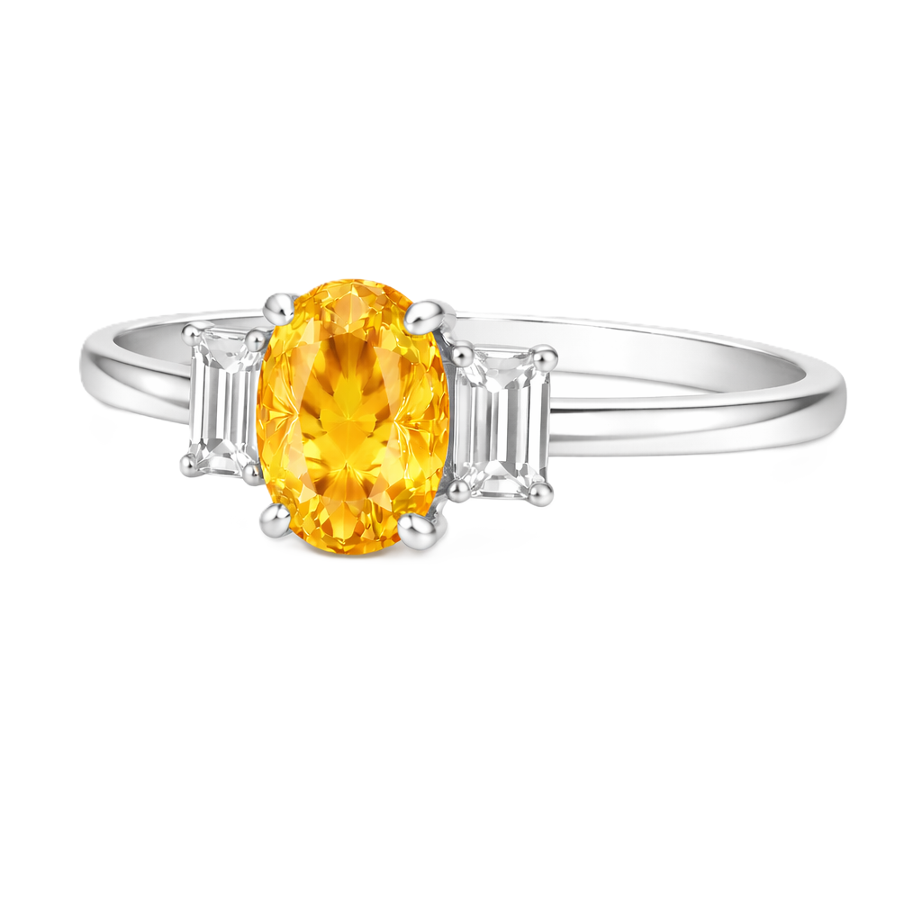 Yellow sapphire engagement ring with 6×4 mm oval center and elegant three-stone design, crafted in white gold-plated 925 silver. Available now at BSI Jewelry.