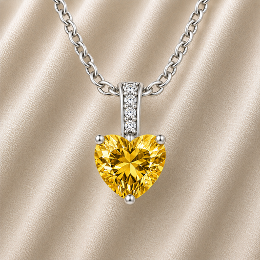 Yellow sapphire heart necklace featuring a vibrant 6 mm heart gemstone in white gold-plated 925 silver. Bright, elegant, and available now at BSI Jewelry.