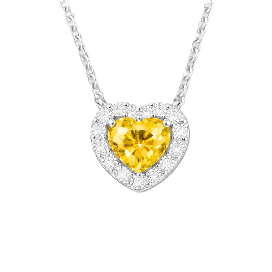 Yellow sapphire heart necklace with 6 mm center stone in white gold-plated 925 silver. Radiant and elegant for everyday wear. Available now at BSI Jewelry.