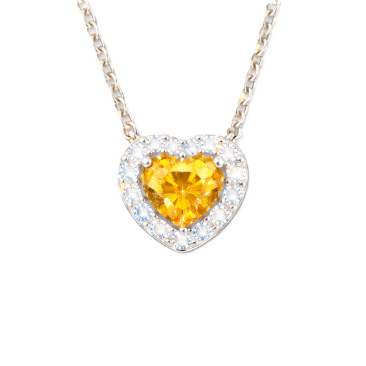 Yellow sapphire heart pendant with 6 mm center stone in white gold-plated 925 silver. Radiant and elegant for everyday wear. Available now at BSI Jewelry.
