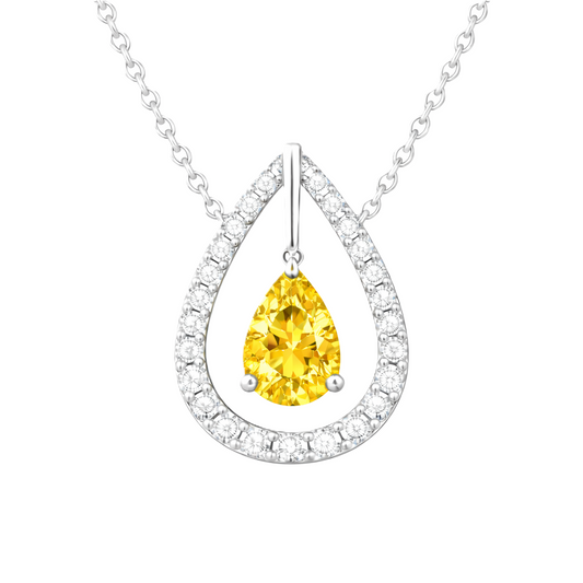 Yellow sapphire necklace with a 7×5 mm pear cut and moissanite halo, crafted in white gold-plated 925 silver. Elegant and radiant. Available now at BSI Jewelry.