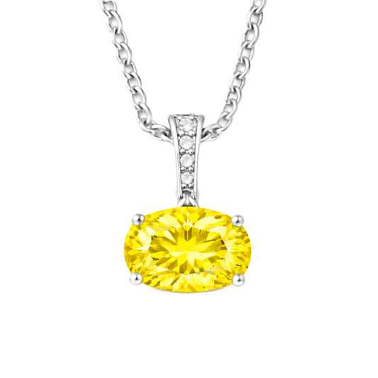 Yellow sapphire oval pendant with an 8×5 mm gemstone in white gold-plated 925 silver, accented with moissanite. Elegant and refined. Available now at BSI Jewelry.