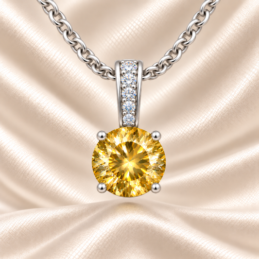 Yellow sapphire pendant with a 6 mm round cut, set in white gold-plated 925 silver. Bright, elegant, and refined for daily wear. Available now at BSI Jewelry.