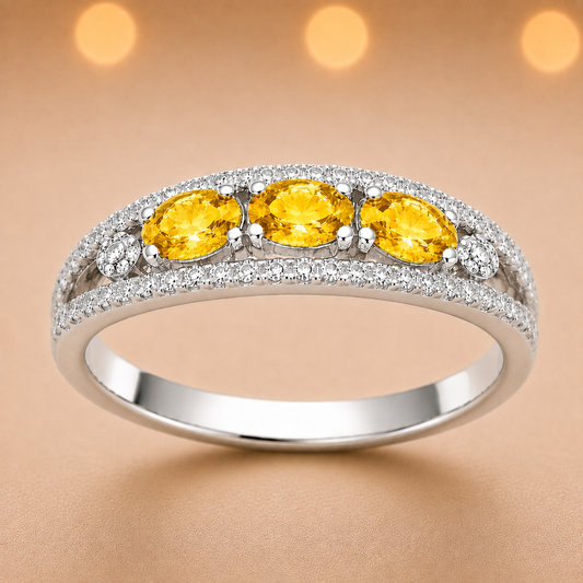 Yellow sapphire ring with 5×3 mm oval stones in white gold-plated 925 silver. Bright, elegant, and hypoallergenic. Available now at BSI Jewelry.