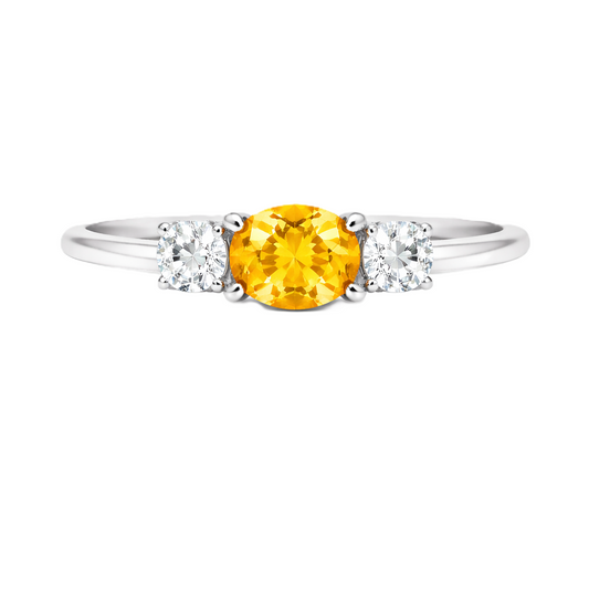 Yellow sapphire ring, 5×4 mm oval with moissanite accents in white gold-plated 925 silver. Bright, elegant, and hypoallergenic. Available now at BSI Jewelry.