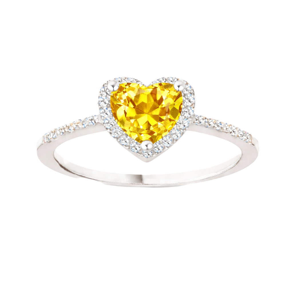 Yellow sapphire ring with a 6 mm heart cut, accented by moissanite in white gold-plated 925 silver. Elegant and timeless. Available now at BSI Jewelry.