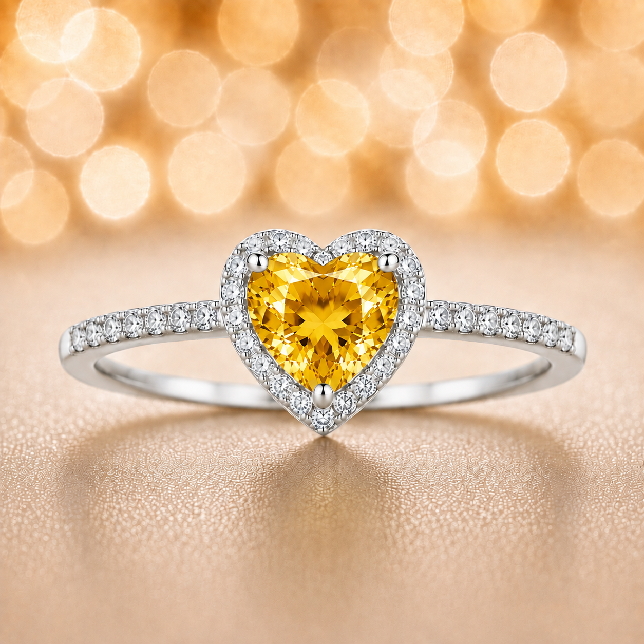 Yellow sapphire ring with a 6 mm heart cut, accented by moissanite in white gold-plated 925 silver. Elegant and timeless. Available now at BSI Jewelry.