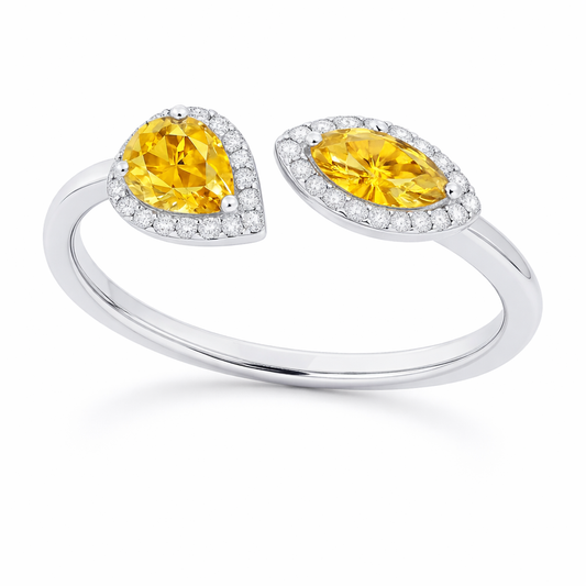 Yellow sapphire ring with 6×3 mm pear and marquise cuts, crafted in white gold-plated 925 silver with moissanite accents. Available now at BSI Jewelry.