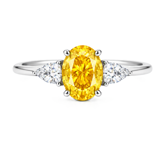 Yellow sapphire ring with 7×5 mm oval center in white gold-plated 925 silver. Hypoallergenic silver for comfortable daily wear. Available now at BSI Jewelry.
