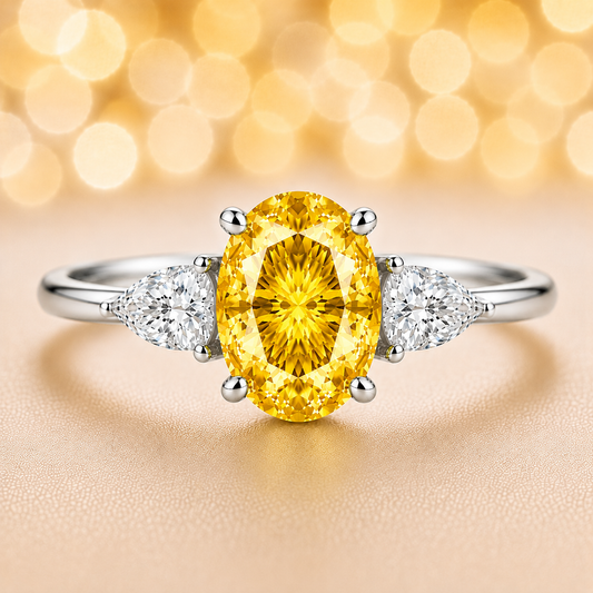 Yellow sapphire ring with 7×5 mm oval center in white gold-plated 925 silver. Hypoallergenic silver for comfortable daily wear. Available now at BSI Jewelry.