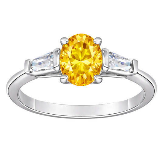 Yellow sapphire ring with 7×5 mm oval center in white gold-plated 925 silver. Bright, elegant, and hypoallergenic. Available now at BSI Jewelry.