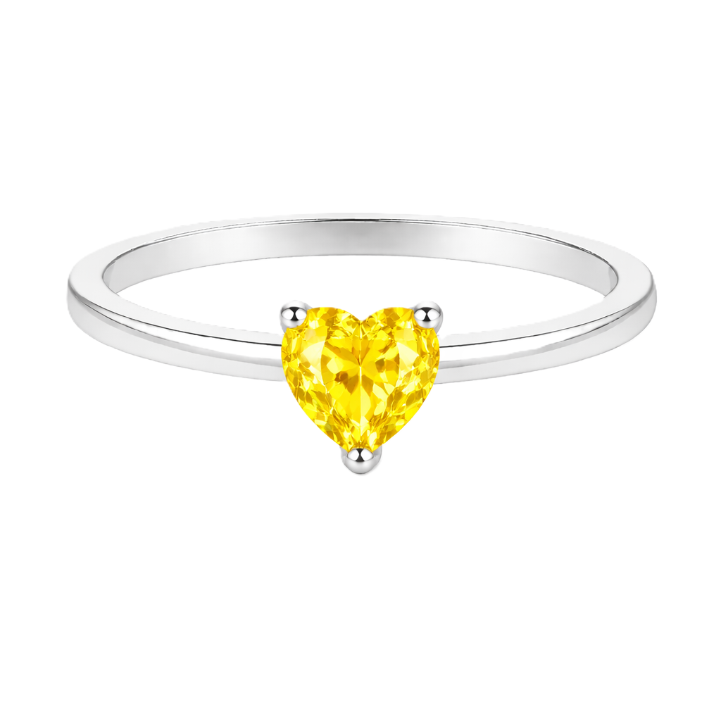 Yellow sapphire solitaire ring with a 5 mm heart in white gold-plated 925 silver. Elegant, minimal, and timeless for daily wear. Available now at BSI Jewelry.