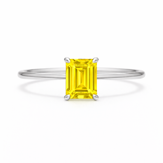Elegant 6×4 mm emerald-cut yellow sapphire ring crafted in white gold-plated 925 silver with palladium alloy. Timeless brilliance. Available now at BSI Jewelry.