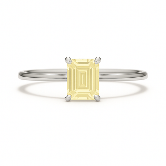 Elegant 6×4 mm emerald-cut yellow sapphire ring crafted in white gold-plated 925 silver with palladium alloy. Timeless brilliance. Available now at BSI Jewelry.