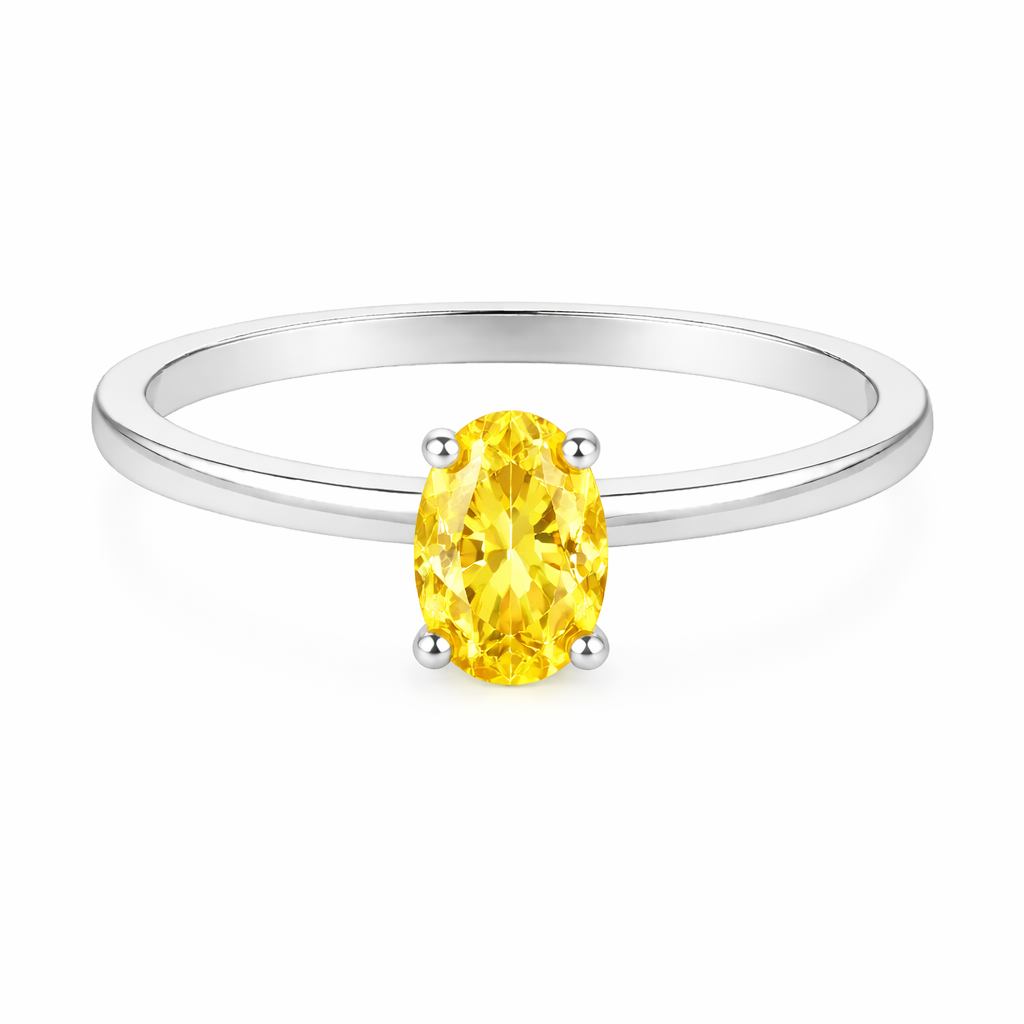 Yellow sapphire solitaire ring with a 6×4 mm oval in white gold-plated 925 silver. Elegant, minimal, and timeless for daily wear. Available now at BSI Jewelry.